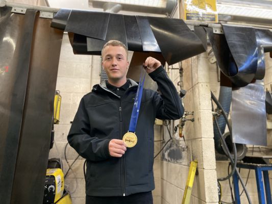 E.G.LEWIS GROUP BACK NPTC STUDENT WITH WORLD SKILLS MEDAL